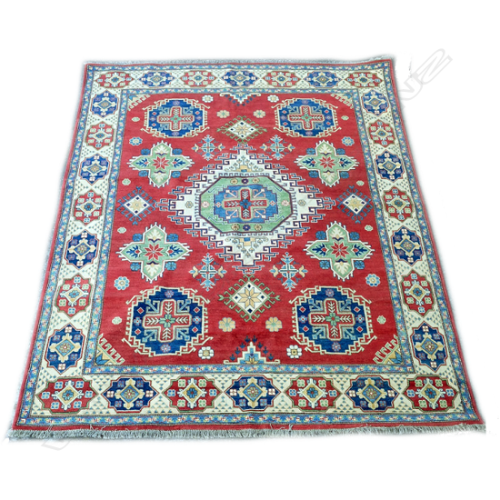 A large hand knotted Kazak carpet