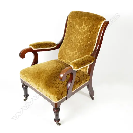A William IV mahogany library chair with scroll arms