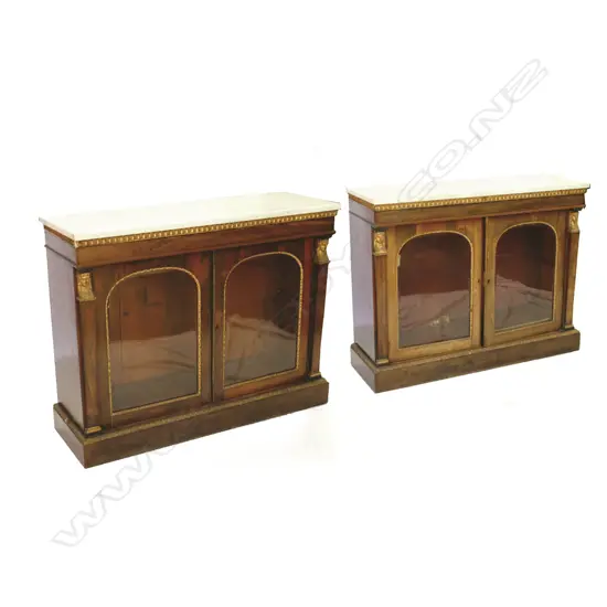 A pair of Victorian walnut two-door pier cabinets