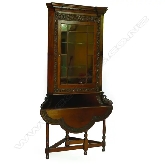 An unusual oak corner cabinet