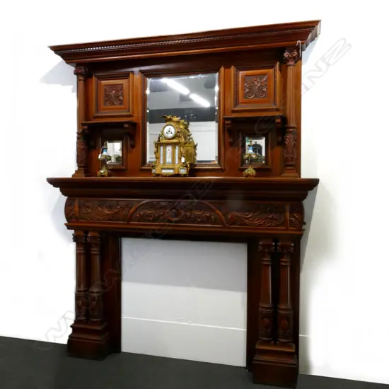 An impressive Victorian carved fireplace mantelpiece with matching overmantel