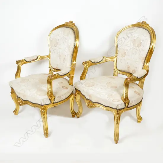 A pair of French style open elbow armchairs