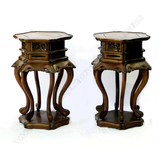 A pair of ornate Chinese rosewood vase stands