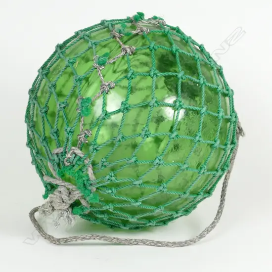 A large green glass fishing float