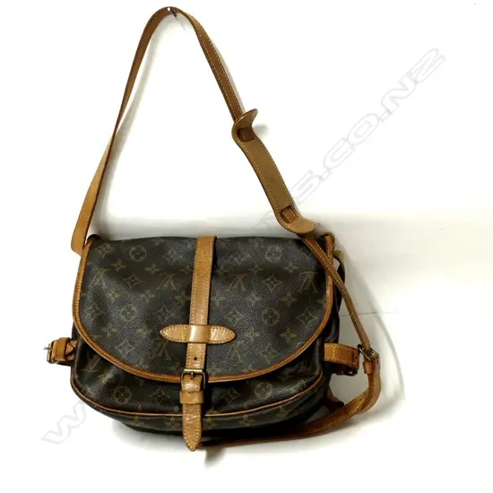 A pre-owned genuine Louis Vuitton Saumur PM handbag