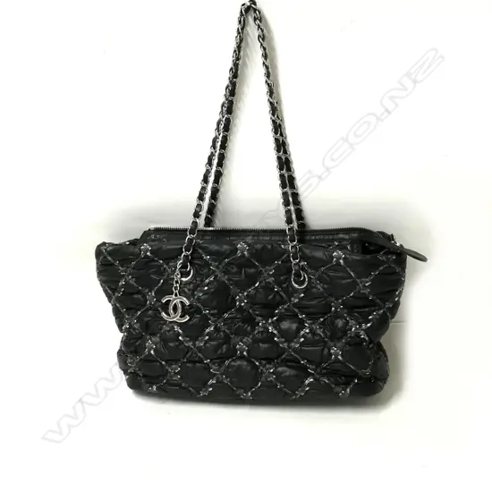 An authentic pre-owned Chanel medium tote bag