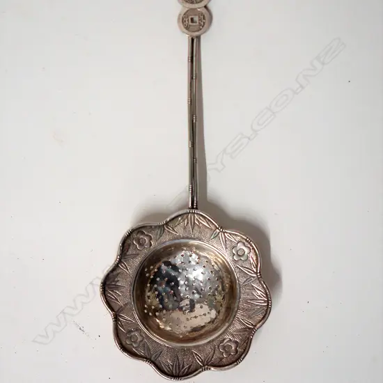 A c.1900 Chinese silver tea strainer