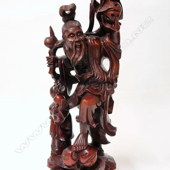 A Chinese carved wood figure of a sage
