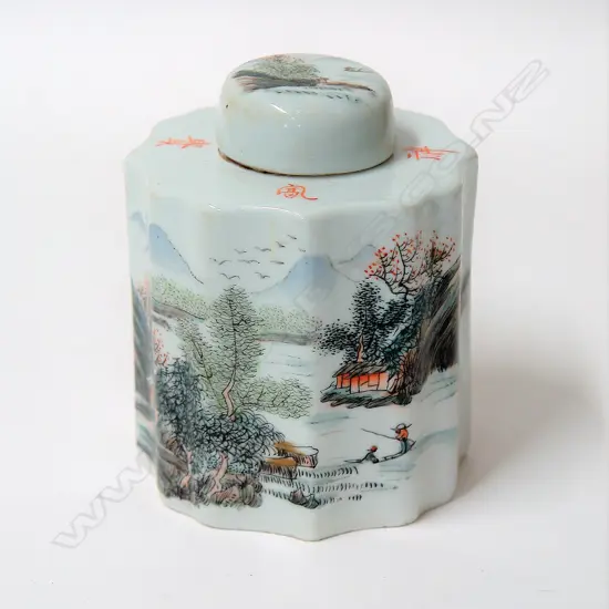 A Chinese porcelain tea caddy of cylindrical shape with a serpentine outline decorated with a landscape view and calligraphic inscription