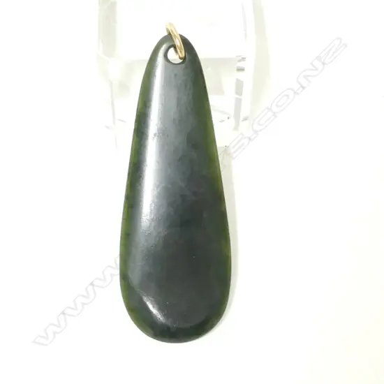 A vintage N.Z. large dark greenstone pendant