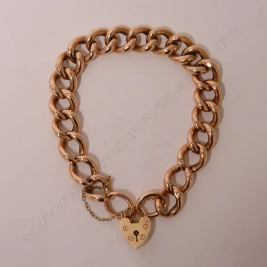 A lady's vintage 9ct. rose gold curb link bracelet
