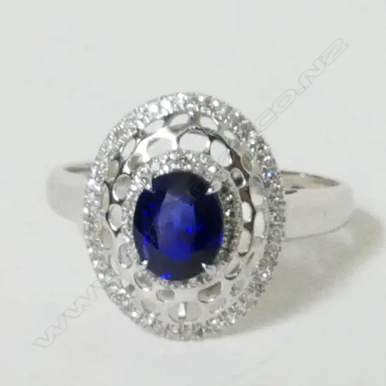 A lady's modern 18ct. white gold sapphire and diamond dress ring