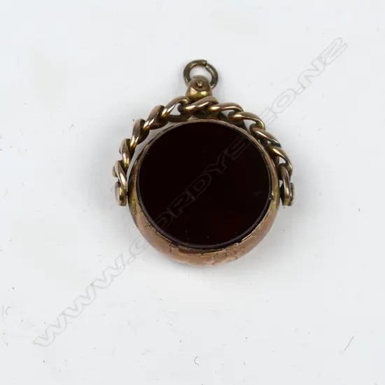 A 9ct. rose gold fob spinner