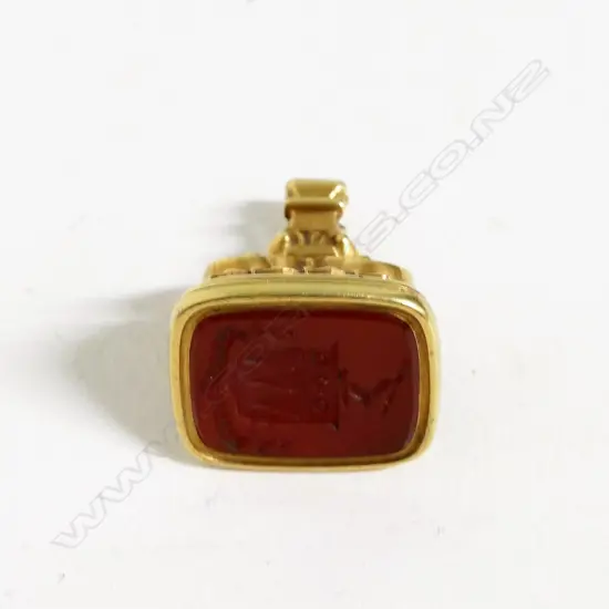 A 9ct. rose gold three-sided fob spinner