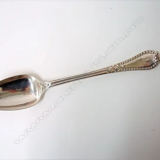 A heavy Victorian silver serving spoon