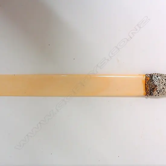 A late Victorian embossed silver handled and ivory long page turner