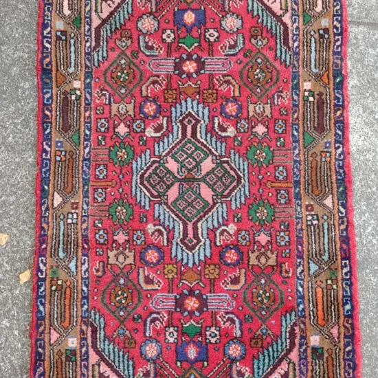 A small hand knotted Persian Hamadan rug