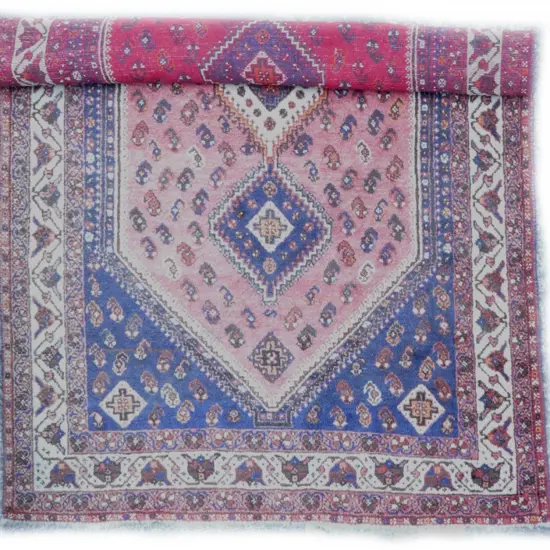 An old hand knotted Persian Shiraz Tabriz rug