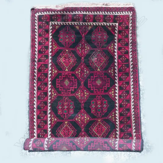 A hand knotted Baluchi rug