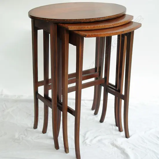 An Edwardian mahogany Sheraton Revival nest of tables