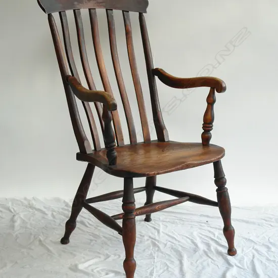 An early 19thC country elm and beech stick-back armchair