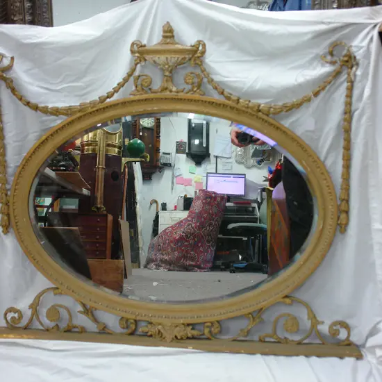 A 19thC French gilded overmantel mirror