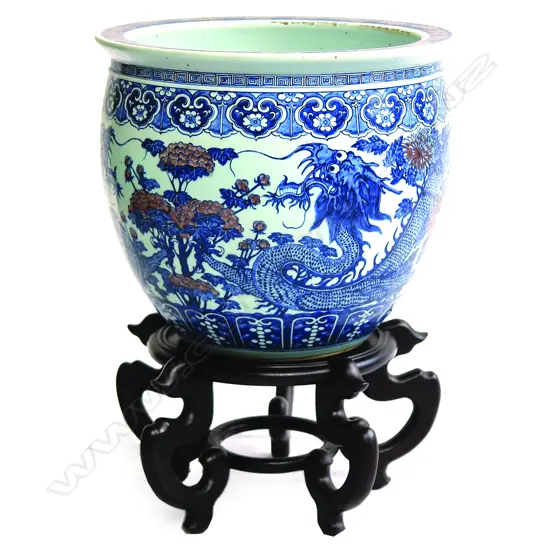 A large Oriental blue and white jardiniere on stand