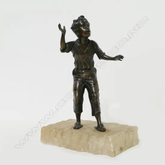 A small bronze study of a young boy