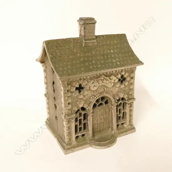 A vintage cast iron nickel plate money bank