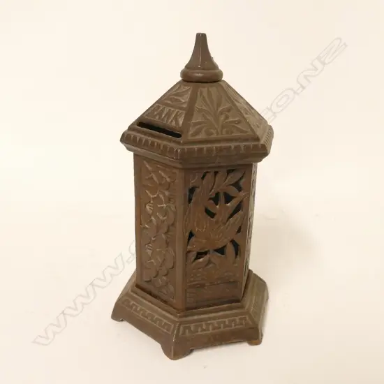 A vintage cast iron money box in the form of a Victorian post box