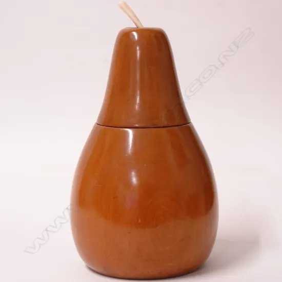 A pear shaped fruitwood tea caddy in the antique manner