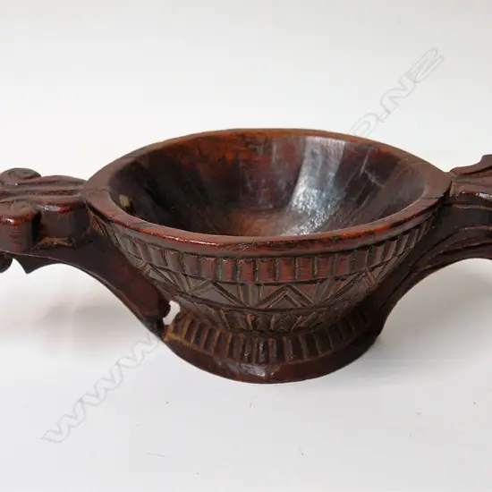 An old European carved wood ceremonial pouring vessel