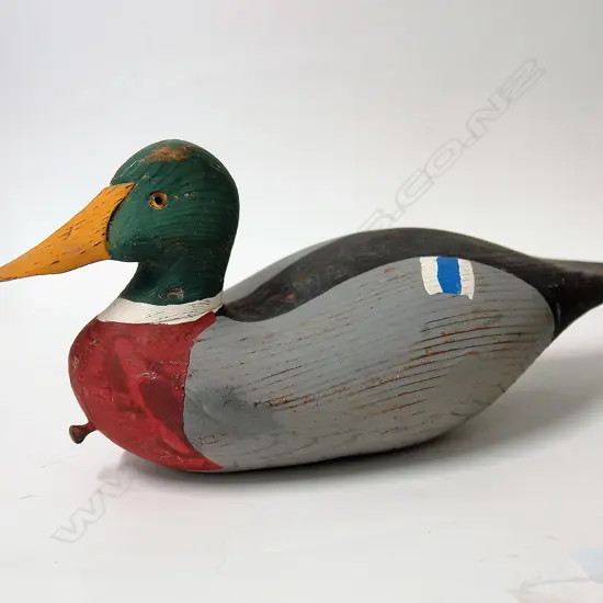 A vintage carved and painted duck decoy