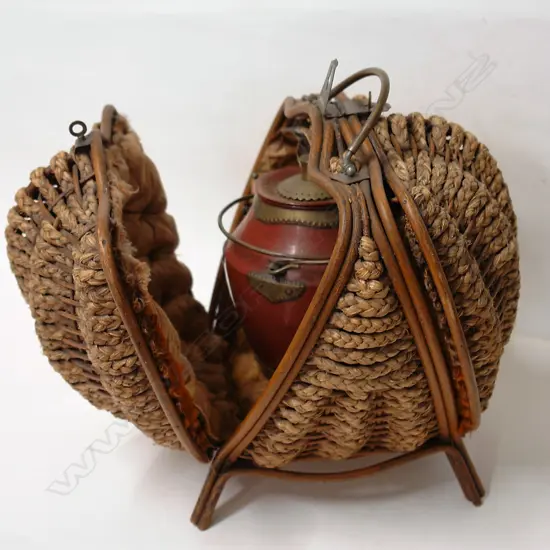 A 19thC highly decorative woven fibre case enclosing a Chinese enamelled teapot