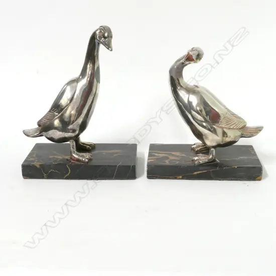 A pair of sculptural bookends modelled as silver plated geese