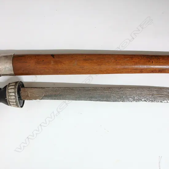 A vintage Indonesian badik knife and scabbard