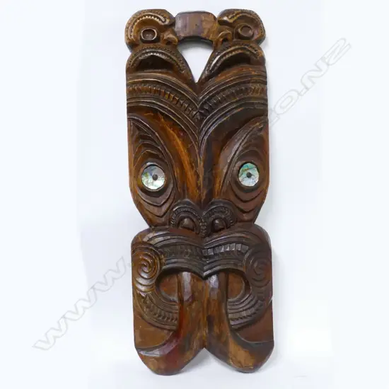 A large Maori carved wheku mask