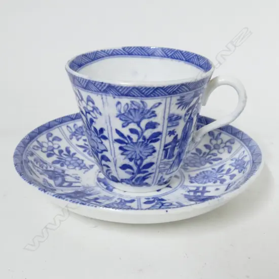 A blue and white bat print chinoiserie cup and saucer