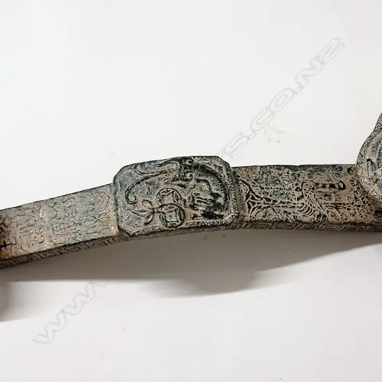 A Chinese archaic style dark green jade ruyi sceptre