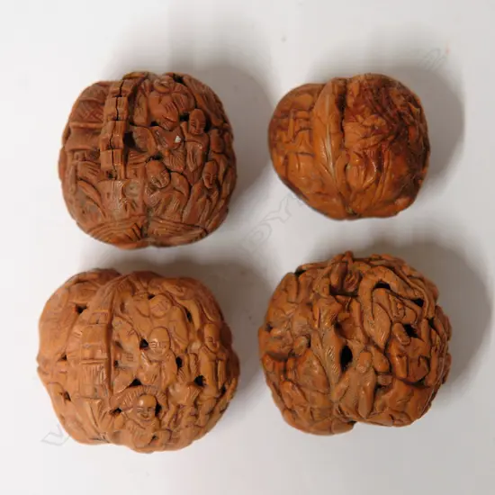 Four old Chinese finely carved walnuts
