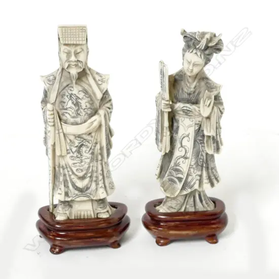 A pair of Chinese carved ivory figures