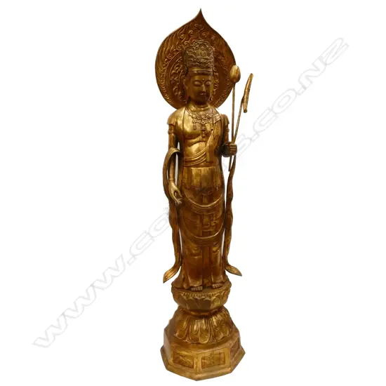 A large floor standing gilt bronze figure of Kuanyin