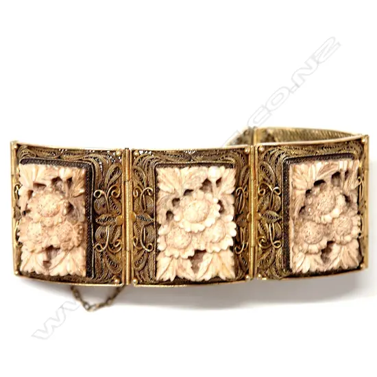 A vintage Eastern silver gilt and carved ivory panelled wide bracelet
