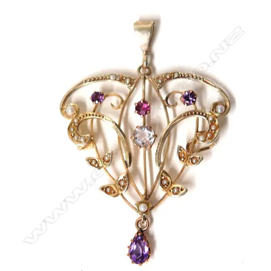 An Edwardian large 9ct. yellow gold coloured stone and seed pearl pendant