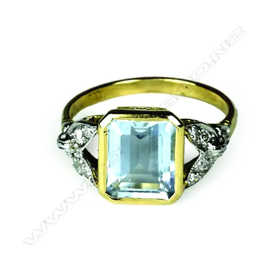 An 18ct. diamond and aquamarine Art Deco style ring