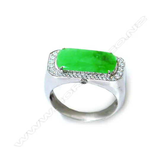 A modern 18ct. white gold jade and diamond dress ring