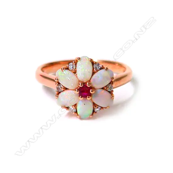 An 18ct. rose gold opal ruby and diamond cluster ring