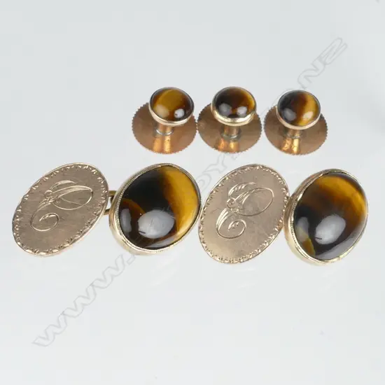 A pair of 9ct. rose gold tiger's eye cufflinks