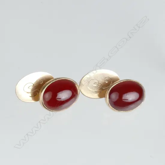A pair of 9ct. rose gold and carnelian cufflinks
