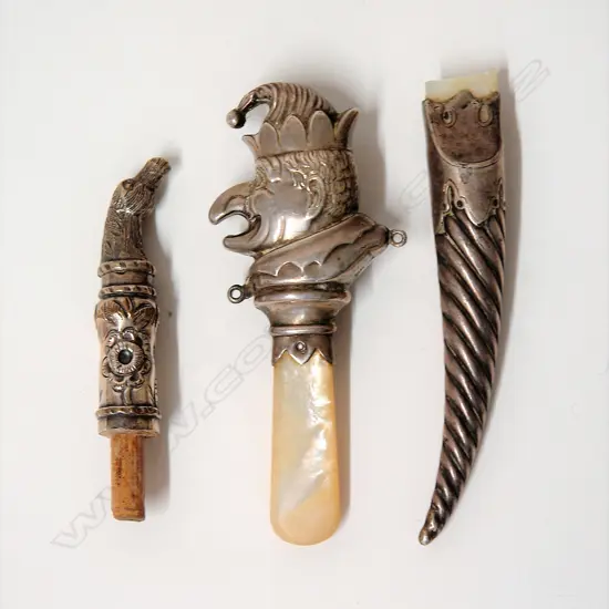 A silver and M.O.P. Punch teething ring and two other items